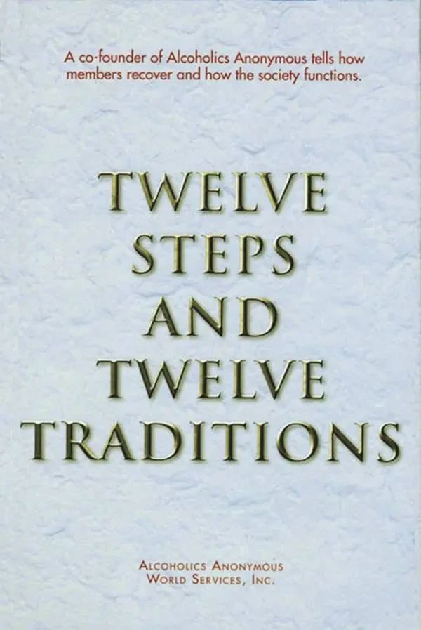 Cover of "Twelve Steps and Twelve Traditions" by Alcoholics Anonymous World Services featuring tan text on white textured background.