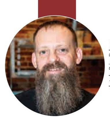 Headshot of a man with a long beard.