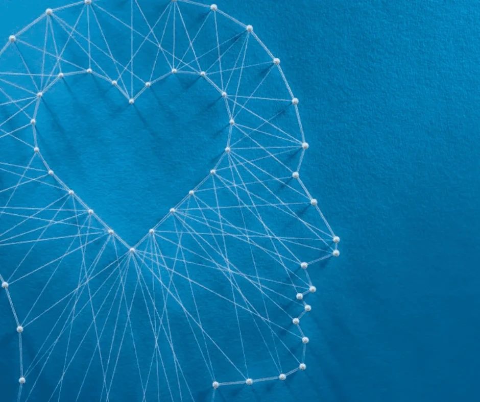 A profile of a human head outlined by string art on a blue background, with a heart shape formed by the internal string pattern.