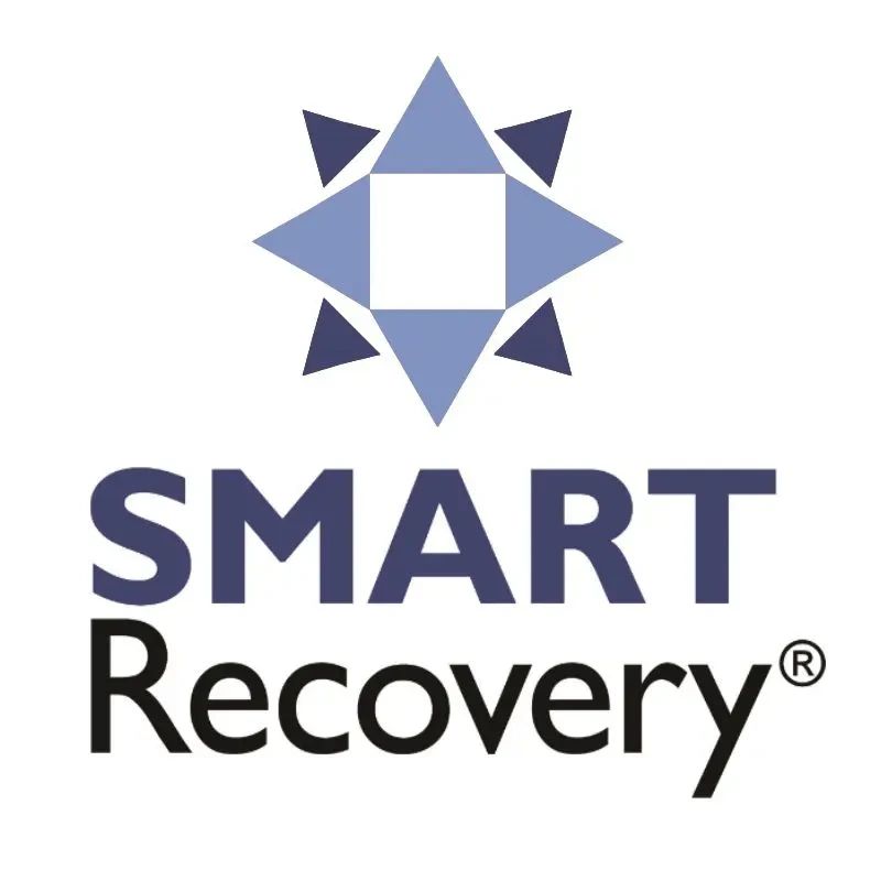 SMART Recovery logo featuring a blue and navy geometric star design with white center and text below.